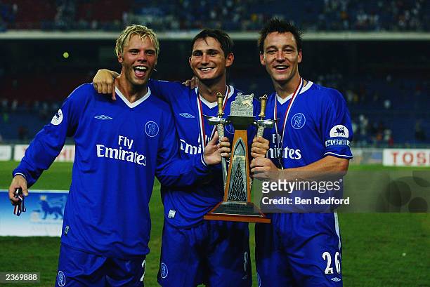 Chelsea players Eidur Gudjohnsen, Frank Lampard and John Terry celebrate victory after the F.A. Premier League Asia Cup Final match between Newcastle...