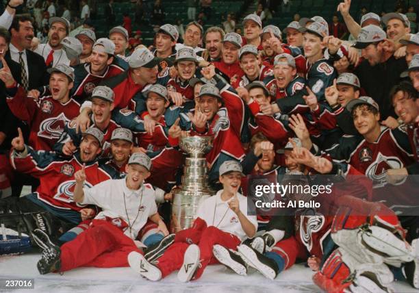 The Colorado Avalanche celebrate after winning the Stanley Cup by defeating the Florida Panthers 1-0 in triple overtime of game four of the Stanley...