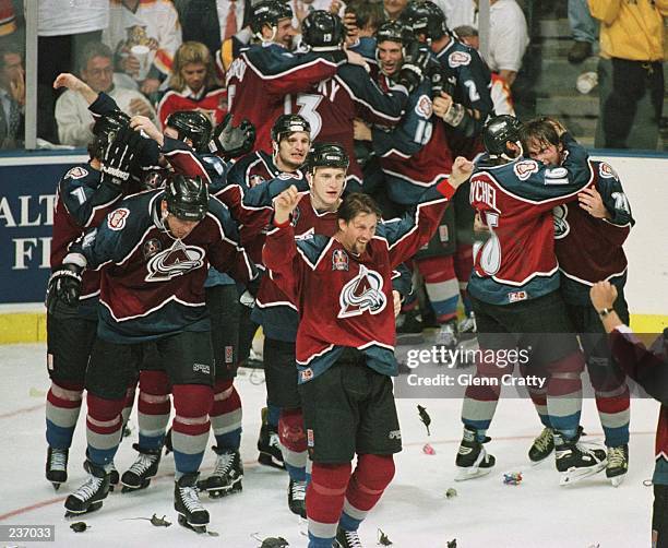 The Colorado Avalanche celebrate after winning the Stanley Cup by defeating the Florida Panthers 1-0 in triple overtime of game four of the Stanley...
