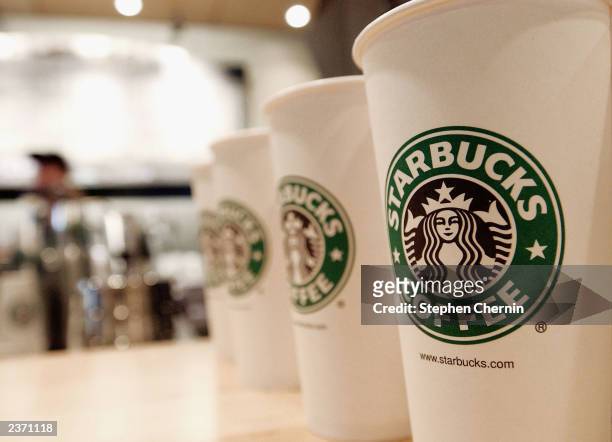 Beverage cups featuring the logo of Starbucks Coffee are seen in the new flagship store on 42nd Street August 5, 2003 in New York City. The...