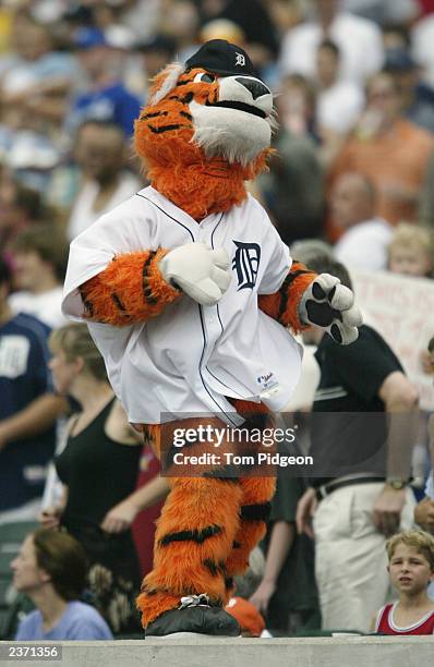 Detroit Tigers mascot, Paws, dances during the MLB game against the Kansas City Royals during the MLB game at Comerica Park on July 27, 2003 in...