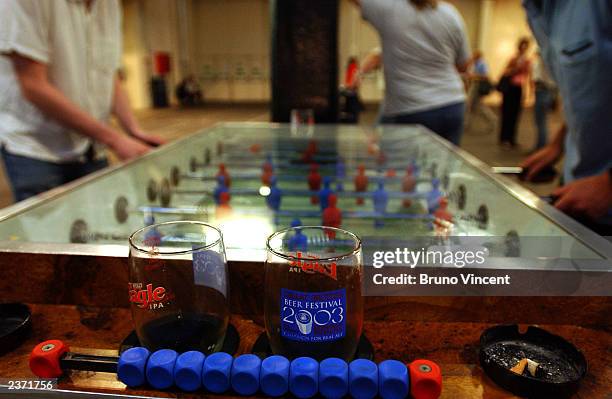 Two men play table football at the Great British Beer Festival at the Olympia Exhibition Center August 5, 2003 in London, England.