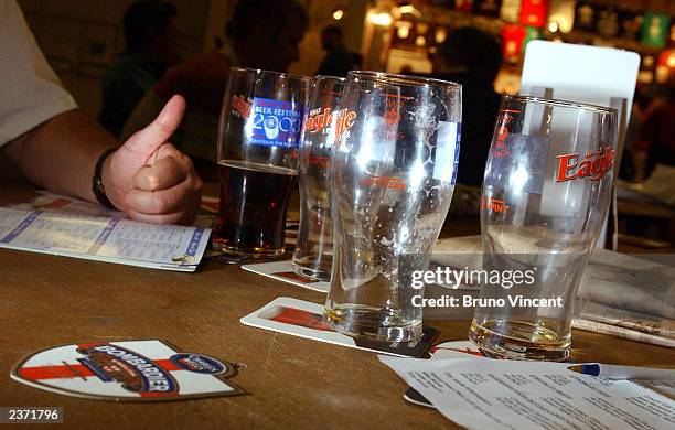 Some empty glasses are left on a table at the Great British Beer Festival at the Olympia Exhibition Center August 5, 2003 in London, England.