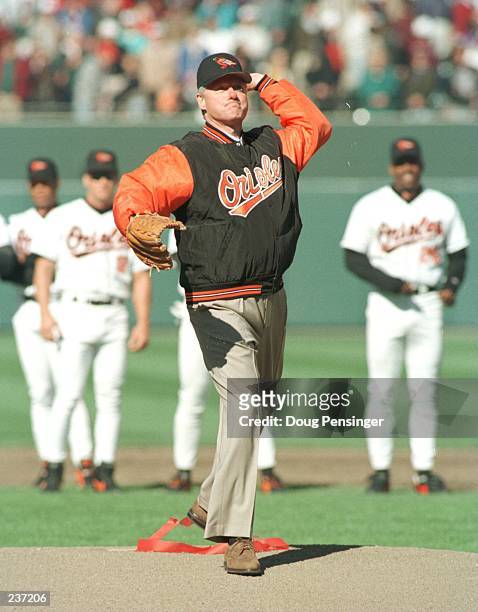 President Bill Clinton throws out the ceremonial first pitch at Oriole Park at Camden Yards as the Baltimore Orioles opened there season versus the...