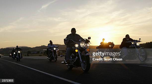 Bikers ride during the annual Sturgis Motorcycle Rally August 5, 2003 on the outskirts of Sturgis, South Dakota. The weeklong event is expected to...