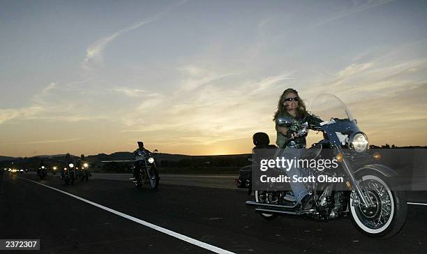 Bikers ride during the annual Sturgis Motorcycle Rally August 5, 2003 on the outskirts of Sturgis, South Dakota. The weeklong event is expected to...