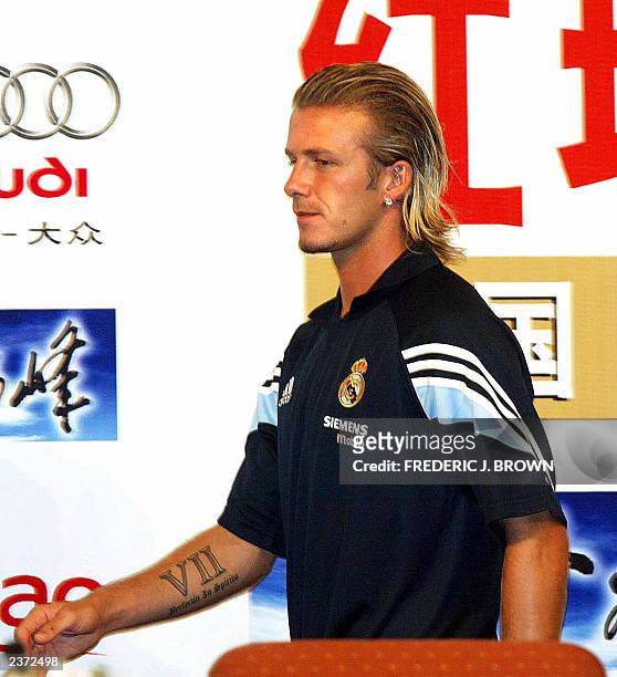 Real Madrid's latest signing David Beckham of England leaves a press conference, 01 August 2003 in Beijing. The Spanish giants arrived in Beijing...