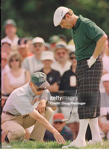 Payne Stewart gets a ruling from a USAG offcial on the seventh hole during 3rd round of the U.S. Open at Oakland Hills Country Club in Bloomfield...