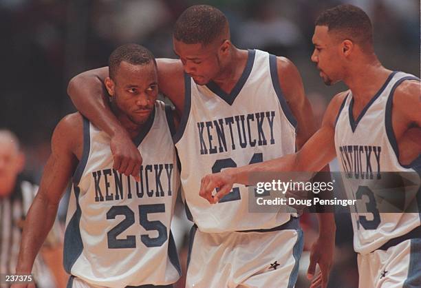 Anthone Epps, Antoine Walker and Ron Mercer of the Kentucky Wildcats talk together during the final of the1996 NCAA Final Four Men''s Basketball...