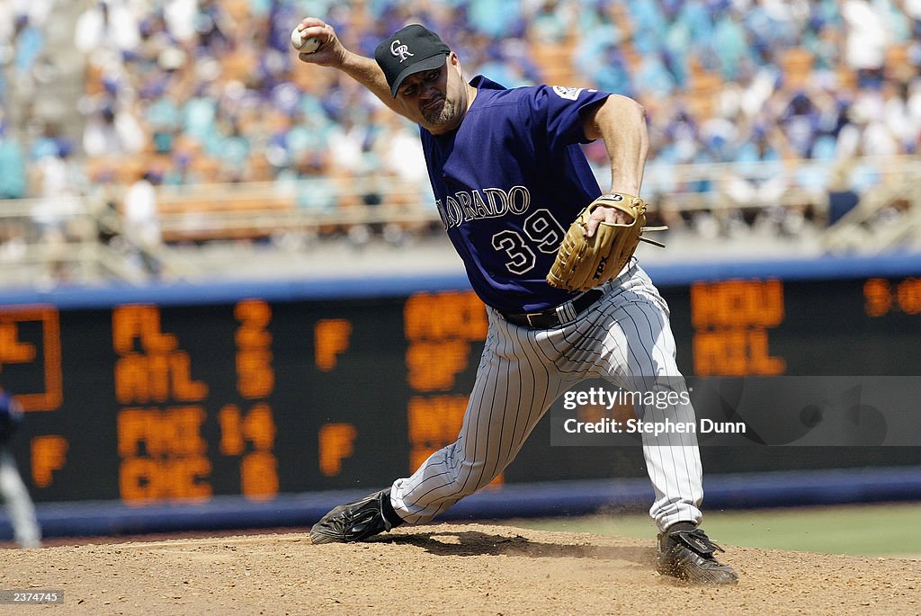 Steve Rash Pitcher Pitcher Steve Reed of the Colorado Rockies delivers a pitch during ...