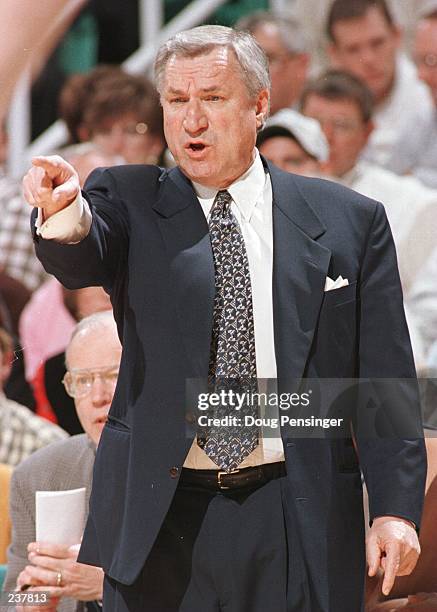 Head coach Dean Smith of the North Carolina Tar Heels shouts instructions from the sideline during the Tar Heels ACC Quarterfinal game against the...