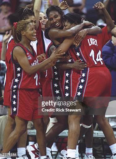 Nikki McCray, left, Lisa Leslie, center, and Venus Lacey, right, of the USA celebrate during the USA women's basketball 111-87 victory over Brazil to...