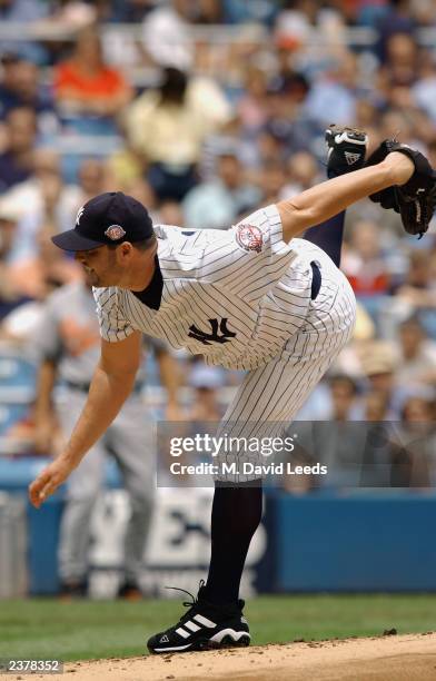 Starting pitcher Roger Clemens of the New York Yankees delivers to the Baltimore Orioles during the MLB game at Yankee Stadium on July 24, 2003 in...