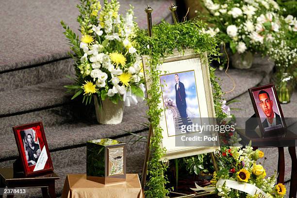 An urn containing Patrick James Dennehy's ashes, photos and flowers were the centerpiece at a memorial services for Dennehy August 7, 2003 at the...