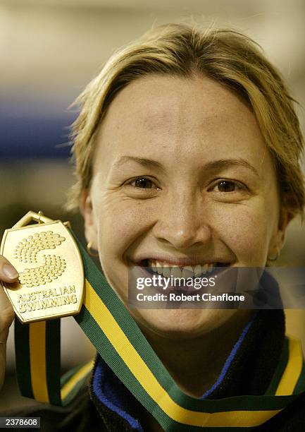 Brook Hanson of Victoria with the gold medal for the Womens 50 metre breaststroke final during day one of the 2003 Telstra Australian Short Course...