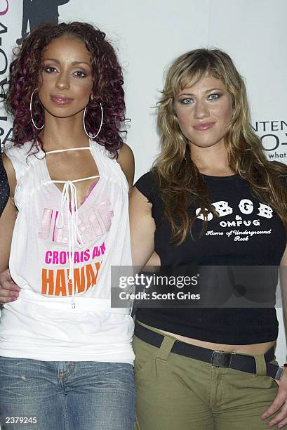 Singers Mya and Lucy Woodward pose backstage at the third annual Pantene Pro-Voice Concert on August 7, 2003 in New York City. The concert is...