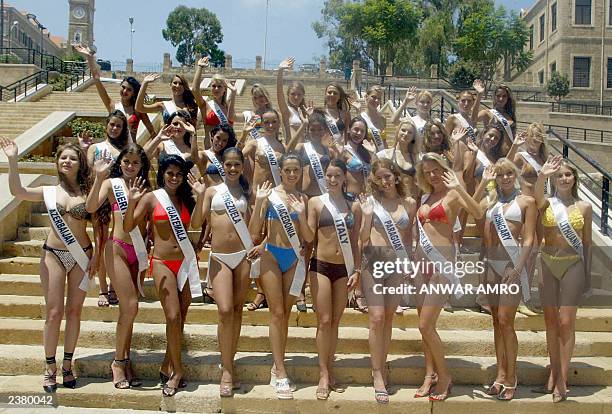 Fourty participants in the Miss Bikini World 2003 competition pose for a photo at the Roman baths in Beirut's Old City 22 July 2003. This event which...