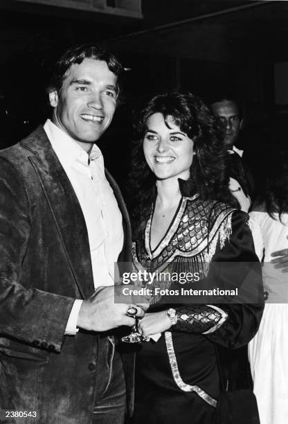 Austrian born actor Arnold Schwarzenegger and girlfriend Maria Shriver pose at SHARE's 29th annual "Boomtown Party" benefit at the Santa Monica Civic...