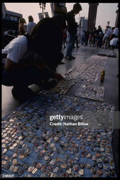 Pin traders display their goods along the sidewalk during the 1992 Summer Olympics in Barcelona, Spain. Mandatory Credit: Nathan Bilow/Allsport