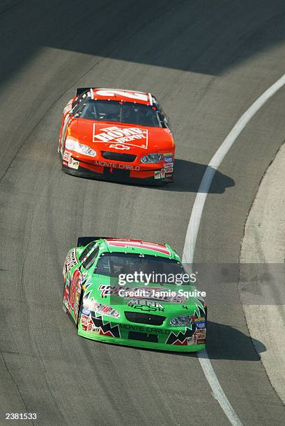 Bobby Labonte, driver of the Joe Gibbs Racing Chevrolet Monte Carlo, races ahead of teammate Tony Stewart, driver of the Joe Gibbs Racing Chevrolet...