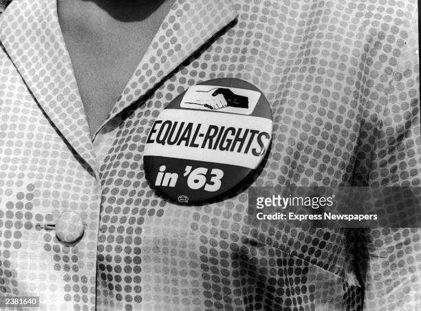 Close-up of a civil rights protest button being worn by a female demonstrator at the March on Washington for Jobs and Freedom, Washington, DC, August...