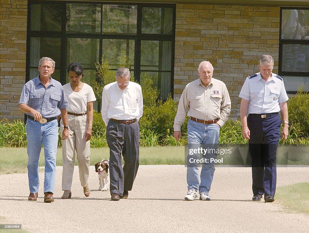 W. Bush Ranch U.S. President George W. Bush walks with U.S. Secretary of Defense ...