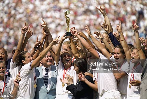 Captian Carla Overbeck of the US Women's Soccer Team raises the World Cup Trophy, as the team celebrates their victory over Team China in the...