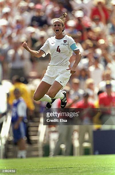Carla Overbeck of Team USA leaps in celebration of the victory over Team China in the Final match of the FIFA Women's World Cup at the Rose Bowl on...