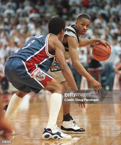 Allen Iverson of Georgetown University looks for room to move past John Celestand of Villanova University during their Big East Season finale at the...