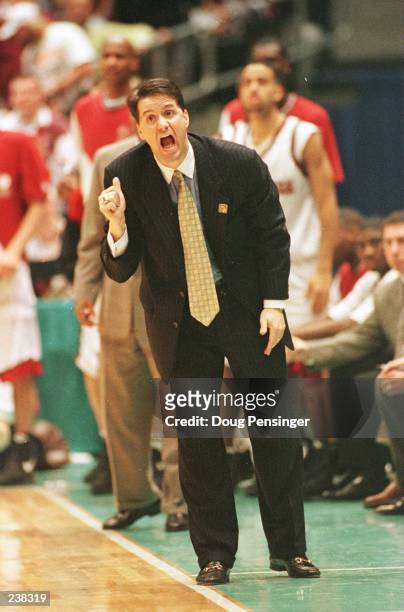 Head coach John Calipari of the UMass Minutemen shouts instructions to his team from the sideline during the Minutemen''s 81-74 NCAA Final Four...