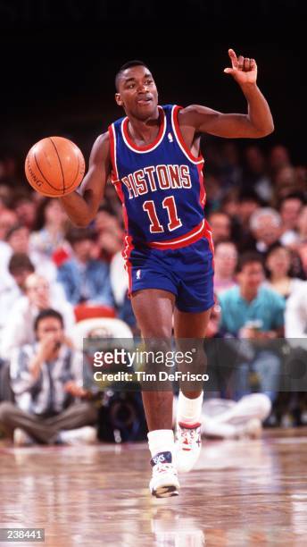 DETROIT POINT GUARD ISIAH THOMAS DRIBBLES THE BALL WHILE CALLING AN OFFENSE DURING THE PISTONS GAME AT THE DENVER NUGGETS.
