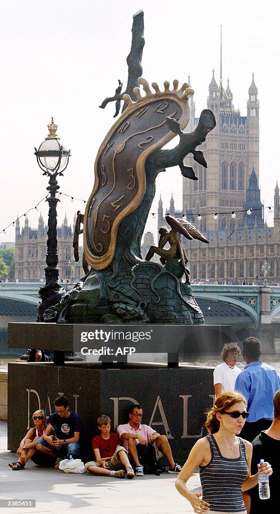 A group of tourists take shelter from th