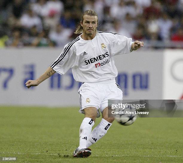 David Beckham of Real Madrid passes the ball during the pre season friendly match between Thailand and Real Madrid at the Rajamangala Stadium on...