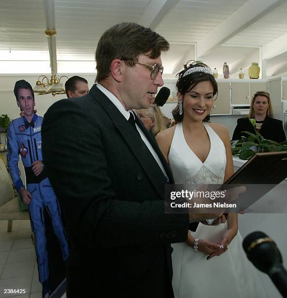 Ekaterina Dmitriev , the bride of Russian cosmonaut Yuri Malenchenko, listens as Seabrook Mayor Robin C. Riley reads a proclamation declaring the day...