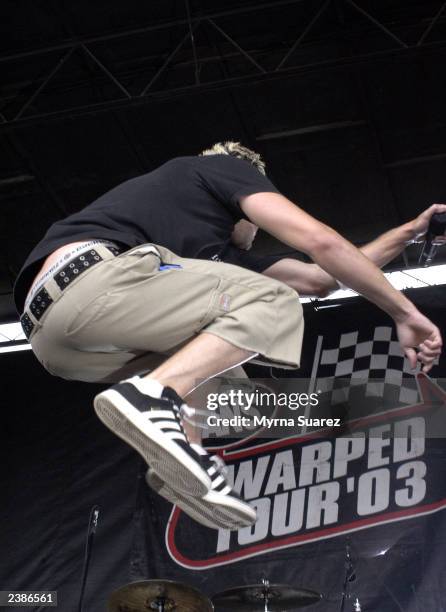 Simple Plan performs at the 2003 Vans Warped Tour on Randall's Island on August 9, 2003 in New York City.