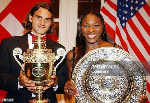 Swiss Roger Federer, the Wimbledon men's singles Tennis Champion, with US Serena Williams, the ladies singles Tennis Champion, pose with their...