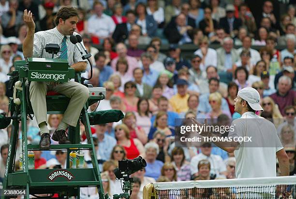 Andy Roddick of the US complains about a call to chair umpire Enric Molina during his semi-final round match against Roger Federer of Switzerland at...