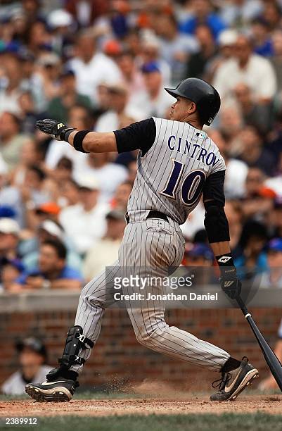 Shortstop Alex Cintron of the Arizona Diamondbacks hits a solo home run against the Chicago Cubs during the National League game at Wrigley Field on...