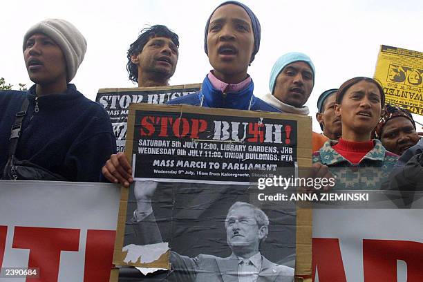Demonstrators shout slogans as 'Bush equals Hitler' and 'Death to America', 09 July 2003 during a demonstration in Cape Town. Some 1000 people...