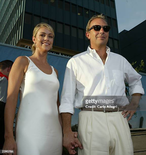 Actor/director Kevin Costner and actress Christine Baumgartner attend the world premiere of Touchstone Pictures' film "Open Range" at the Cinerama...