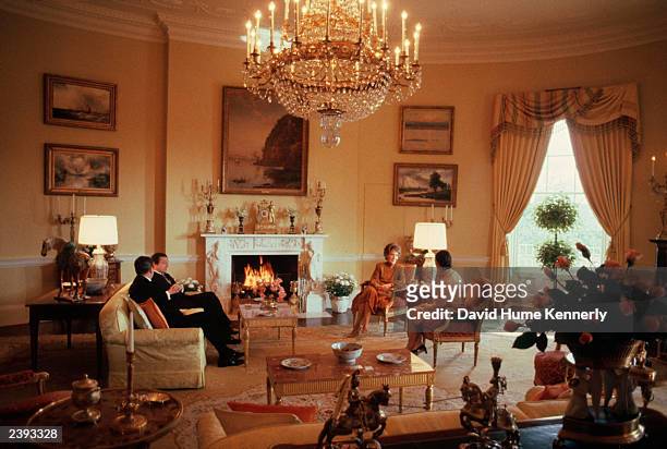 President Ronald Reagan and wife Nancy enterain King Carl XVI Gustav of Sweden and his wife Queen Silvia November 1981 on the second floor of the...