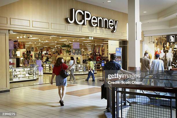 Shoppers enter a J.C. Penney store August 12, 2003 in Riverside, Illinois. The retailer reported a narrower quarterly loss due to stronger department...
