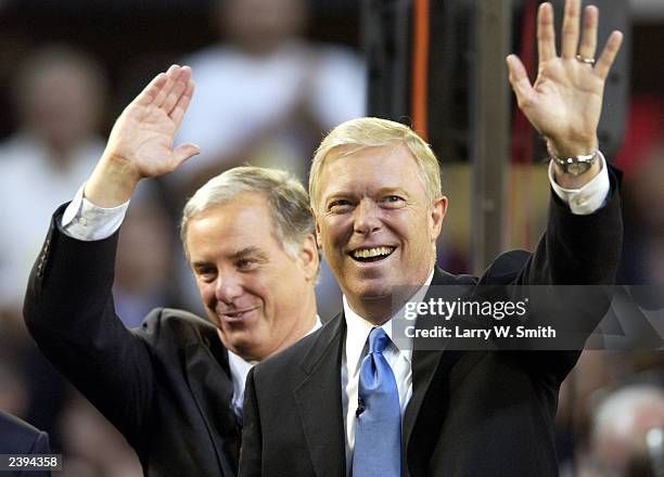 Rep. Dick Gephardt and former Vermont Gov. Howard Dean acknowledge a crowd of 5,800 after a political forum for Democratic candidates for president...