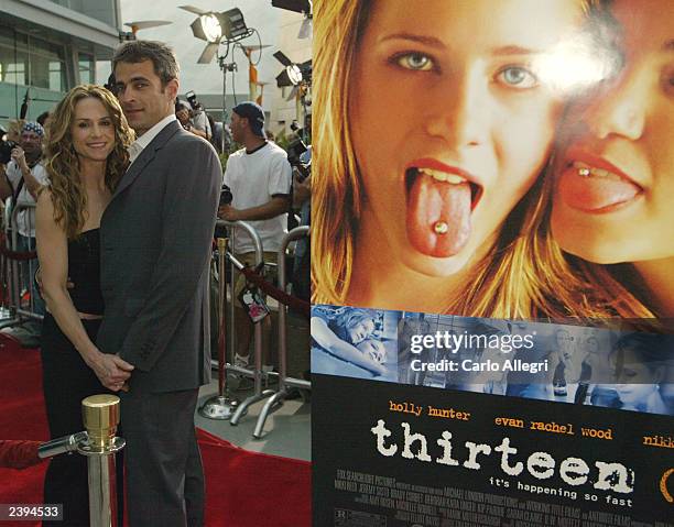 Actress Holly Hunter and her boyfriend Gordon MacDonald attend the Fox Searchlight's premiere of "Thirteen" at the Arclight Cinemas, August 12, 2003...