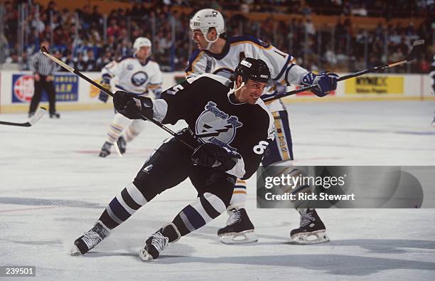 Forward Petr Klima of the Tampa Bay Lightning battles with a player from the Buffalo Sabres for a loose puck during the Lightning''s 2-1 victory over...