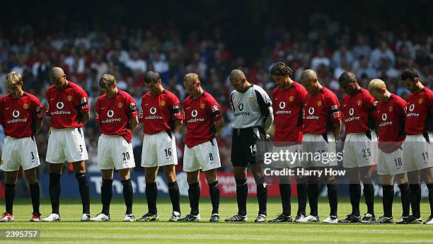 The Manchester United players stand for the minutes silence in respect for team-mate Jimmy Davis who tragically died in a car crash the day before...
