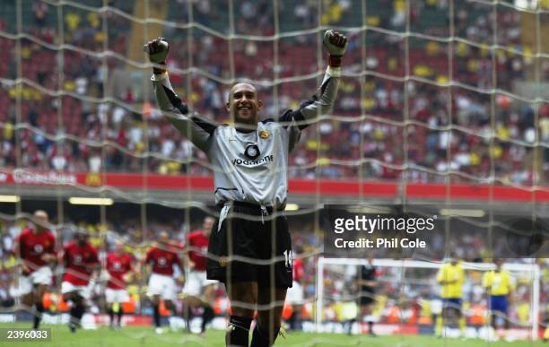 Tim Howard of Manchester United celebrates winning the Community Shield after he saves the final penalty from Robert Pires of Arsenal during the FA...