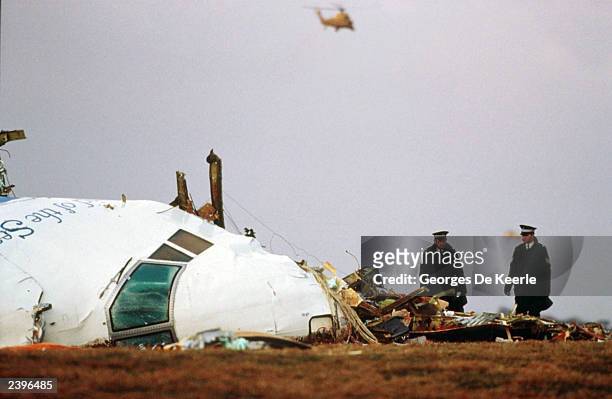 Officials inspect the wreckage of Pan Am flight 103 December 21, 1988 in Lockerbie, Scotland. U.N. Diplomats said August 12, 2003 that the U.S.,...