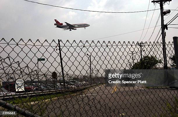 Plane lands at Newark International Airport August 13, 2003 in Newark, New Jersey. Hemant Lakhani, one of three men arrested on August 12, was...