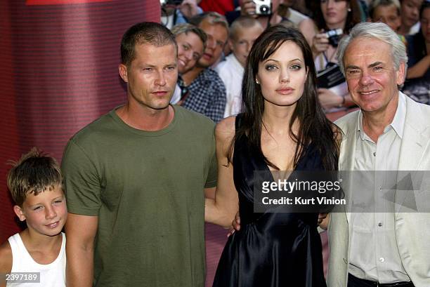 German actor Til Schweiger with his son Valentine, actress Angelina Jolie and director Jan De Bont pose for photographers at the premiere of her new...